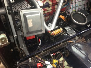 Plan A - ECU and fuse box position behind driver's seat.