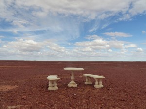 Monumental table and chairs, positioned in the middle of nowhere