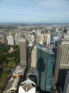 A view from the Sydney Tower, looking down at the skyscrapers - you can see the shadow from the tower.